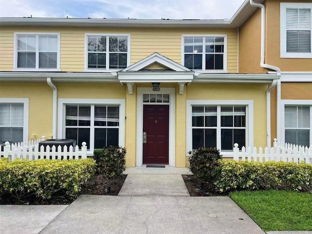 4010 Santa Maria Dr Unit 106, Kissimmee, FL 34741 - view of exterior entry featuring stucco siding