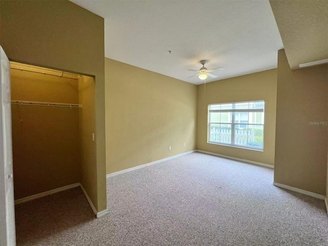 4010 Santa Maria Dr Unit 106, Kissimmee, FL 34741 - unfurnished bedroom featuring carpet, baseboards, a closet, and ceiling fan
