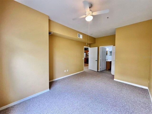 4010 Santa Maria Dr Unit 106, Kissimmee, FL 34741 - spare room featuring carpet, ceiling fan, and baseboards