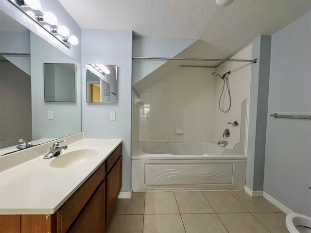 4010 Santa Maria Dr Unit 106, Kissimmee, FL 34741 - bathroom featuring washtub / shower combination, a textured ceiling, tile patterned flooring, vanity, and baseboards