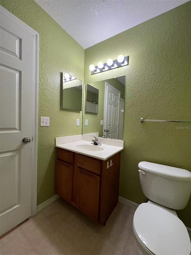4010 Santa Maria Dr Unit 106, Kissimmee, FL 34741 - half bathroom featuring vanity, a textured wall, and toilet