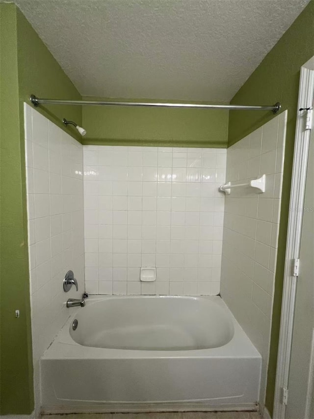 4010 Santa Maria Dr Unit 106, Kissimmee, FL 34741 - full bathroom featuring a textured ceiling and shower / washtub combination