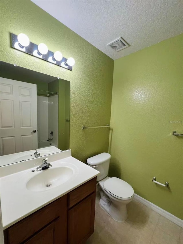 4010 Santa Maria Dr Unit 106, Kissimmee, FL 34741 - full bathroom with a textured wall, vanity, toilet, a textured ceiling, and baseboards