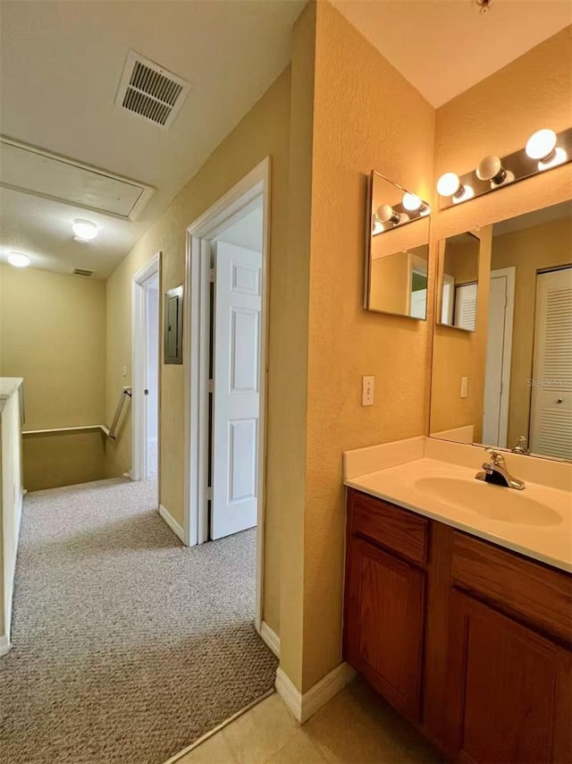 4010 Santa Maria Dr Unit 106, Kissimmee, FL 34741 - bathroom featuring vanity, electric panel, a textured wall, and baseboards