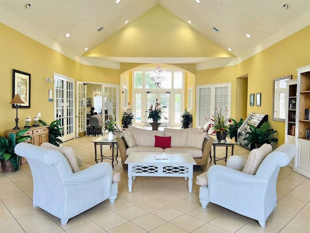 4010 Santa Maria Dr Unit 106, Kissimmee, FL 34741 - living room with high vaulted ceiling, light tile patterned floors, french doors, recessed lighting, and arched walkways