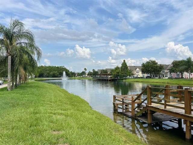 4010 Santa Maria Dr Unit 106, Kissimmee, FL 34741 - dock featuring a water view, a yard, and a residential view