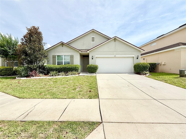 238 Miniehaha Cir, Haines City, FL 33844 - view of front of house featuring a garage, a front yard, driveway, and stucco siding