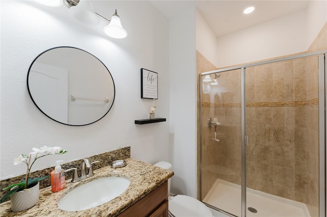 2923 Banana Palm Dr, Kissimmee, FL 34747 - bathroom featuring vanity, a shower stall, and toilet