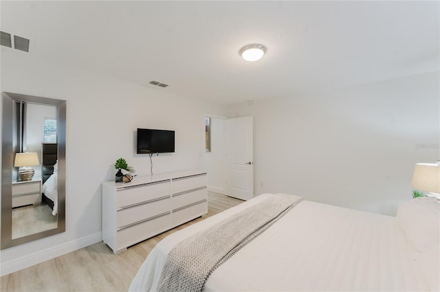 2923 Banana Palm Dr, Kissimmee, FL 34747 - bedroom with light wood-type flooring and baseboards