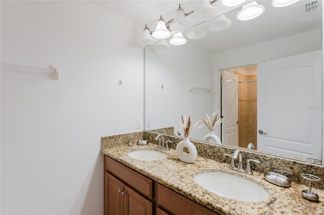 2923 Banana Palm Dr, Kissimmee, FL 34747 - bathroom featuring double vanity and a shower