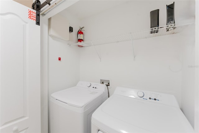 2923 Banana Palm Dr, Kissimmee, FL 34747 - laundry area with washer and clothes dryer