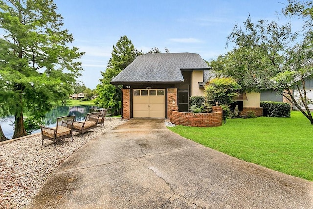 3501 Danby Ct, Orlando, FL 32812 - view of front of house featuring brick siding, a front lawn, a water view, concrete driveway, and an attached garage