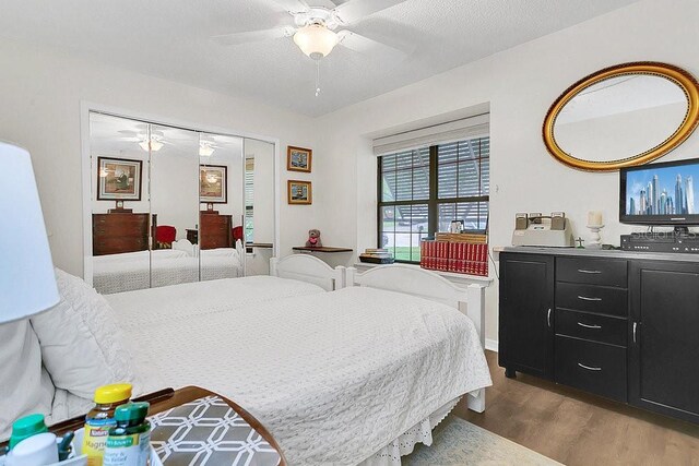 3501 Danby Ct, Orlando, FL 32812 - bedroom featuring wood finished floors and a ceiling fan