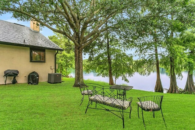 3501 Danby Ct, Orlando, FL 32812 - view of grassy yard featuring a water view and central AC