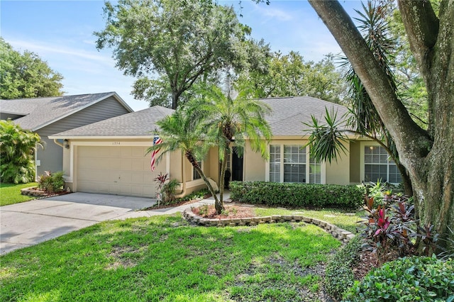 1354 Dutch Elm Dr, Altamonte Springs, FL 32714 - single story home featuring a garage, stucco siding, concrete driveway, a front lawn, and a shingled roof