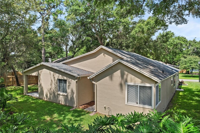 1354 Dutch Elm Dr, Altamonte Springs, FL 32714 - view of property exterior featuring a shingled roof, stucco siding, and view of wooded area