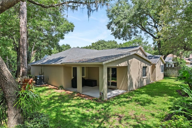 1354 Dutch Elm Dr, Altamonte Springs, FL 32714 - rear view of property with stucco siding, a patio, central AC, and a shingled roof