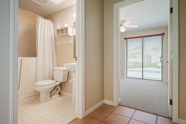 357 Fairway Pointe Cir, Orlando, FL 32828 - bathroom with toilet, tile patterned floors, and baseboards