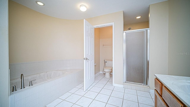 357 Fairway Pointe Cir, Orlando, FL 32828 - bathroom with a garden tub, vanity, a stall shower, tile patterned floors, and recessed lighting