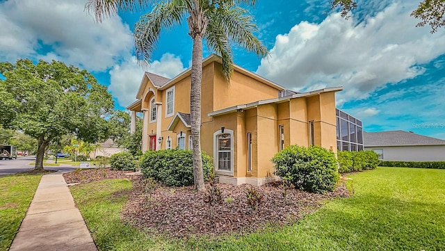 357 Fairway Pointe Cir, Orlando, FL 32828 - view of property exterior featuring stucco siding and a lawn