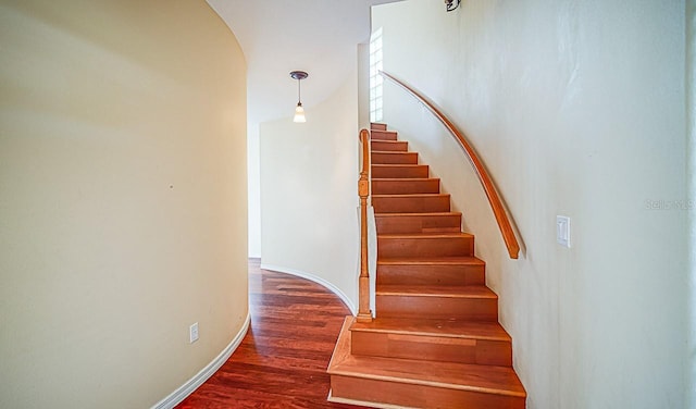 357 Fairway Pointe Cir, Orlando, FL 32828 - staircase with wood finished floors and arched walkways