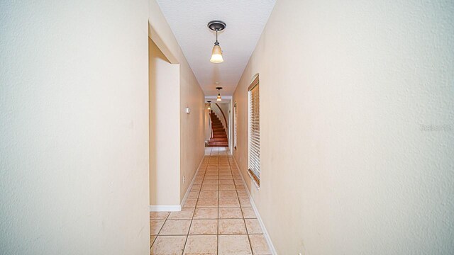 357 Fairway Pointe Cir, Orlando, FL 32828 - hall with light tile patterned floors and stairs