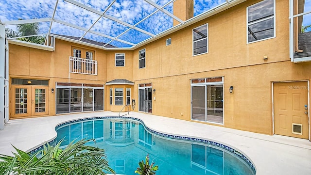 357 Fairway Pointe Cir, Orlando, FL 32828 - outdoor pool featuring a patio and glass enclosure
