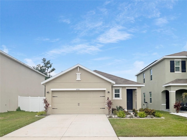 10956 Carlton Fields Dr, Riverview, FL 33579 - view of front of house featuring driveway, stucco siding, and a garage