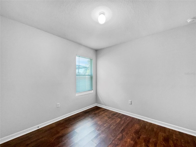 10956 Carlton Fields Dr, Riverview, FL 33579 - spare room with dark wood finished floors and baseboards