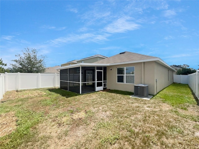 10956 Carlton Fields Dr, Riverview, FL 33579 - rear view of property with central AC unit, a sunroom, and stucco siding