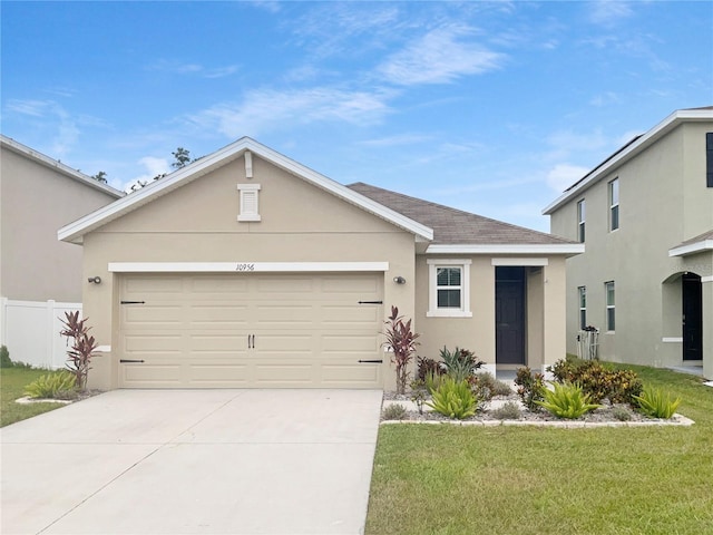 10956 Carlton Fields Dr, Riverview, FL 33579 - view of front of house featuring stucco siding, driveway, an attached garage, and roof with shingles