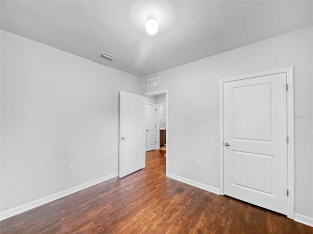 10956 Carlton Fields Dr, Riverview, FL 33579 - unfurnished bedroom with wood finished floors and baseboards