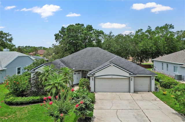 468 Alinole Loop, Lake Mary, FL 32746 - view of front of property with concrete driveway, a garage, roof with shingles, stucco siding, and central AC unit