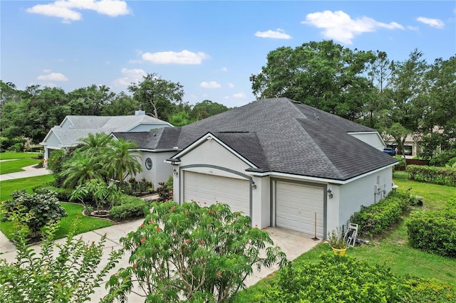 468 Alinole Loop, Lake Mary, FL 32746 - view of front of property featuring stucco siding, a shingled roof, a garage, and concrete driveway