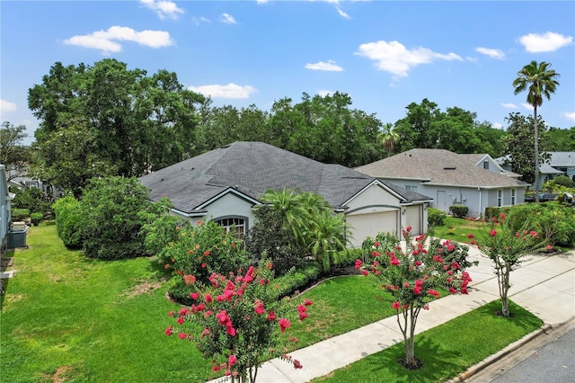 468 Alinole Loop, Lake Mary, FL 32746 - view of front of property featuring a garage, a front lawn, cooling unit, and concrete driveway