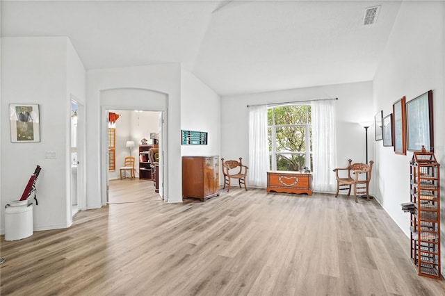 468 Alinole Loop, Lake Mary, FL 32746 - living area with light wood-style floors and vaulted ceiling