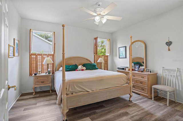 468 Alinole Loop, Lake Mary, FL 32746 - bedroom with multiple windows, light wood-type flooring, ceiling fan, and baseboards