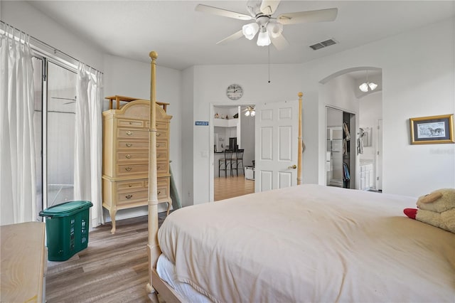 468 Alinole Loop, Lake Mary, FL 32746 - bedroom featuring arched walkways, wood finished floors, and a ceiling fan