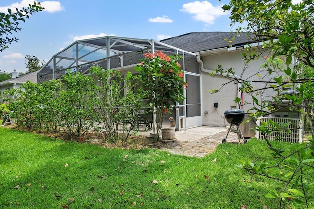 468 Alinole Loop, Lake Mary, FL 32746 - back of property with a patio area, a yard, stucco siding, a shingled roof, and a lanai