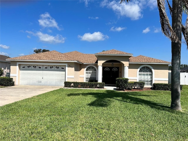 517 Westwind Dr, Davenport, FL 33896 - mediterranean / spanish-style house with stucco siding and a front yard