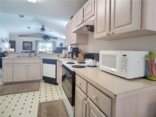 517 Westwind Dr, Davenport, FL 33896 - kitchen featuring white appliances, under cabinet range hood, a peninsula, a sink, and lofted ceiling