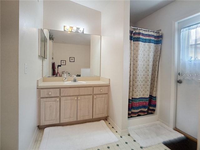 517 Westwind Dr, Davenport, FL 33896 - full bathroom featuring vanity, a shower with shower curtain, and baseboards