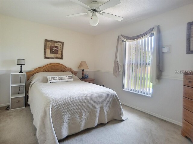 517 Westwind Dr, Davenport, FL 33896 - carpeted bedroom featuring a ceiling fan and baseboards