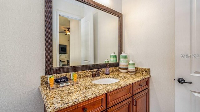 7411 Excitement Dr, Reunion, FL 34747 - bathroom with vanity and a ceiling fan