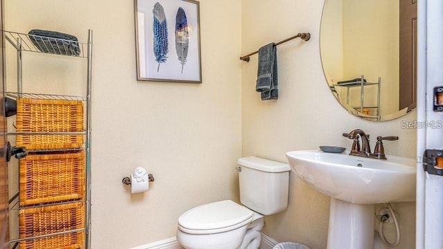 7411 Excitement Dr, Reunion, FL 34747 - bathroom featuring toilet and baseboards