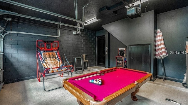 7411 Excitement Dr, Reunion, FL 34747 - recreation room featuring concrete block wall and billiards table
