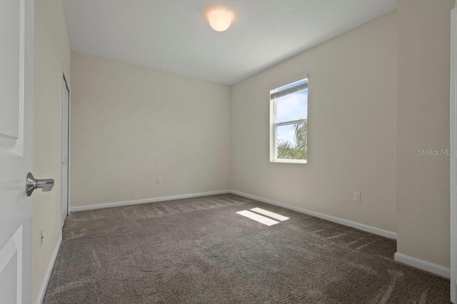 877 Ocean Course Ave, Davenport, FL 33896 - carpeted spare room with baseboards