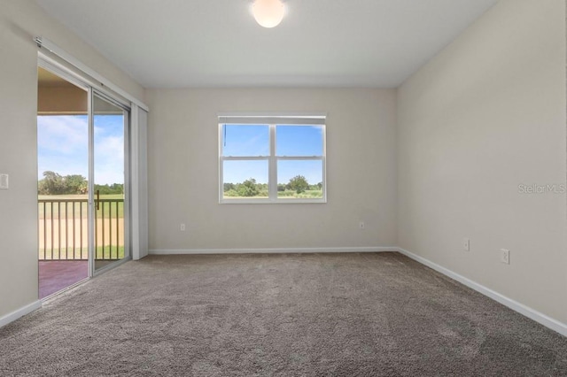 877 Ocean Course Ave, Davenport, FL 33896 - carpeted empty room featuring baseboards