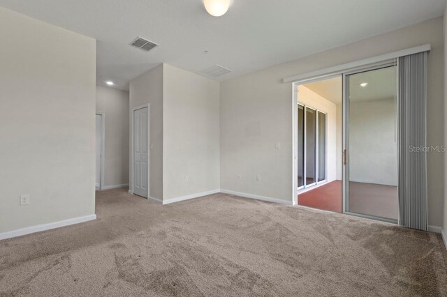 877 Ocean Course Ave, Davenport, FL 33896 - carpeted empty room featuring baseboards and recessed lighting