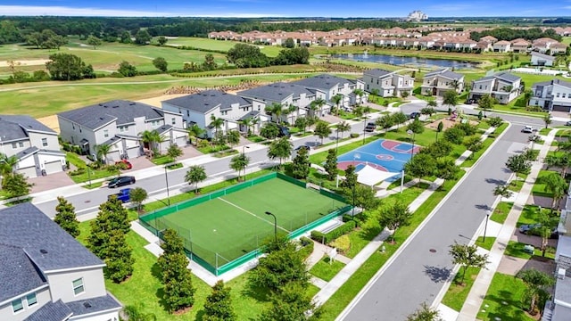 877 Ocean Course Ave, Davenport, FL 33896 - aerial view of residential area with a nearby body of water and a local golf course